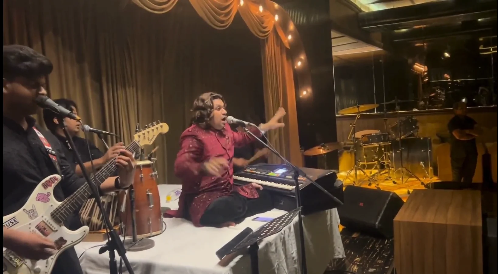 Crowd dancing to high-energy Bollywood and Punjabi live music by Mehfil-E-Murshid Band at a premium nightclub in Delhi NCR